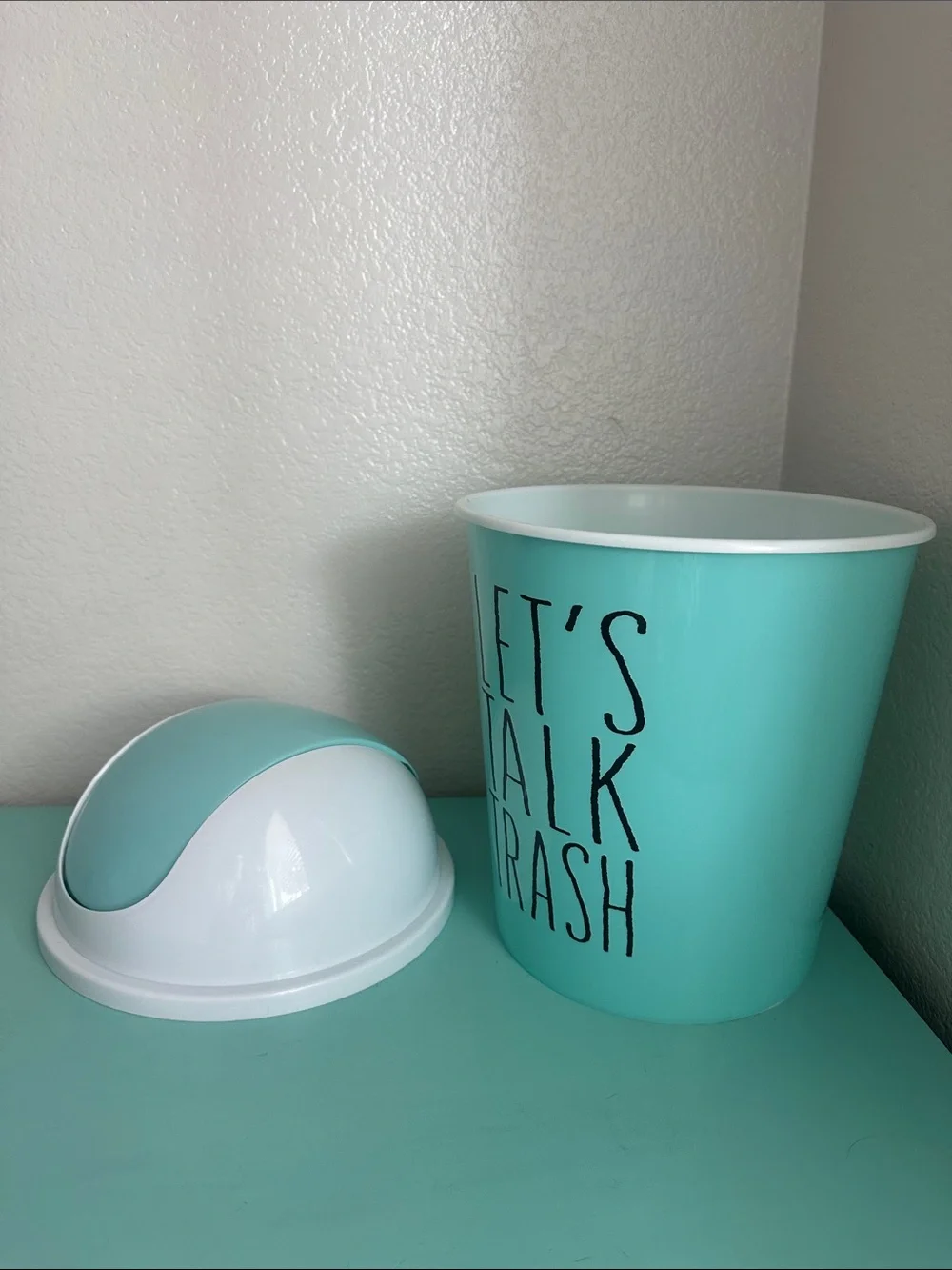 Essential Home Designs-basic plastic trash can with swinging top-new